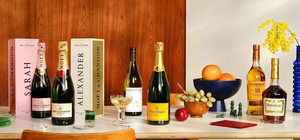 Premium champagne, wine, whisky and cognac with fruit and glassware