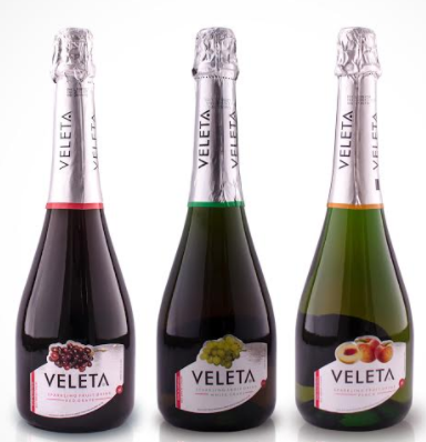 Veleta sparkling fruit drink bottles: red grape, white grape, and peach